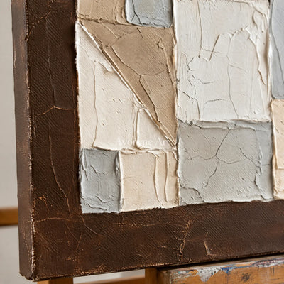 Close-up of the hand-painted texture of Mineral Rhythm neutral geometric relief diptych on an easel