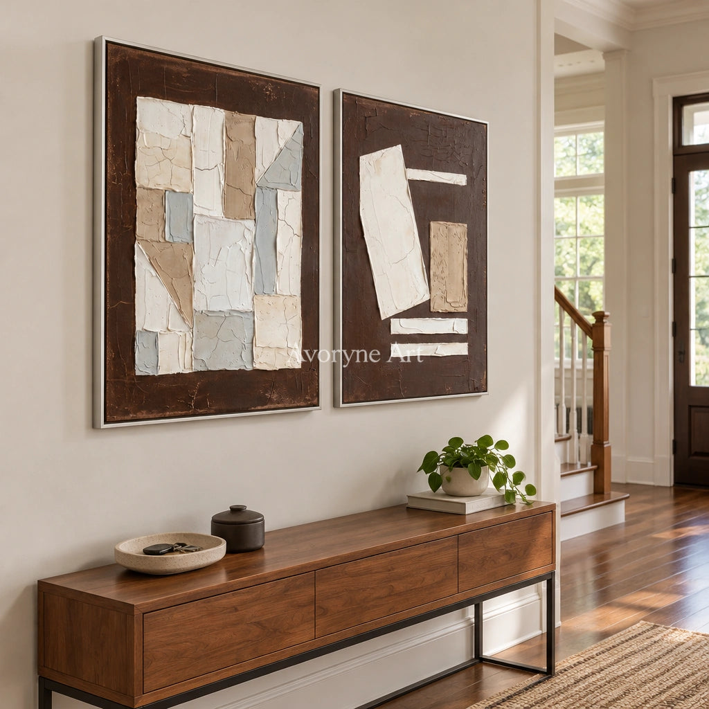 Mineral Rhythm neutral geometric relief diptych with a silver frame in an entryway