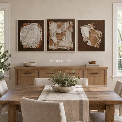 Soft Sonata neutral geometric relief triptych with a white frame in a dining room