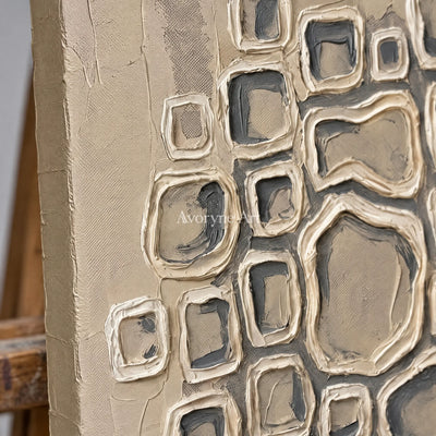 Close-up of the hand-painted texture of Weathered Interval neutral grid texture wall art on an easel