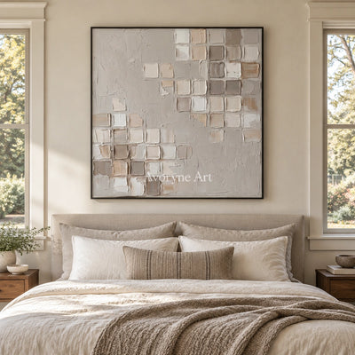 Weathered Mosaic neutral grid texture wall art with a black frame above a bed in a bedroom