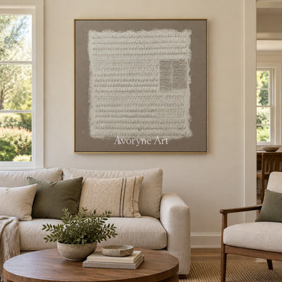 Woven Mosaic neutral grid texture wall art with a gold frame hanging in a living room
