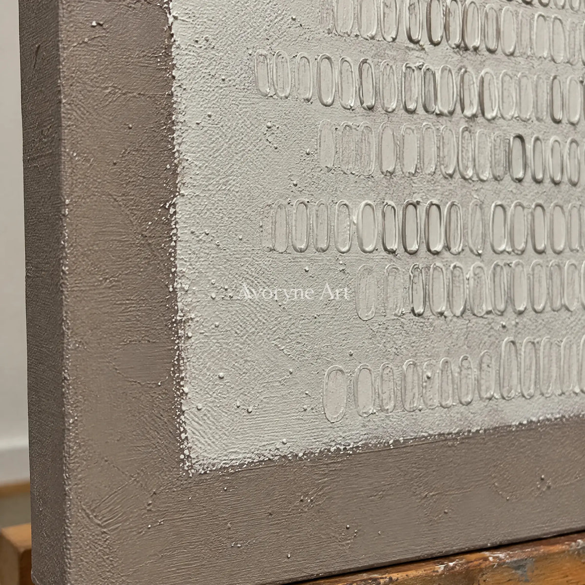 Close-up of the hand-painted texture of Woven Solace neutral grid texture wall art on an easel