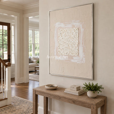Weathered Refrain neutral layered relief wall art with a silver frame in an entryway