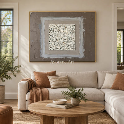 Weathered Drift neutral layered relief wall art with a gold frame hanging in a living room
