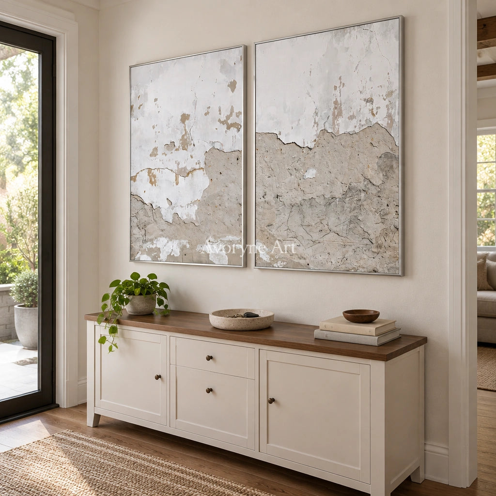 Muted Solace neutral mineral texture diptych with a silver frame in an entryway