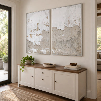 Muted Solace neutral mineral texture diptych with a silver frame in an entryway
