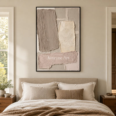 Weathered Haven neutral patch relief wall art with a black frame above a bed in a bedroom