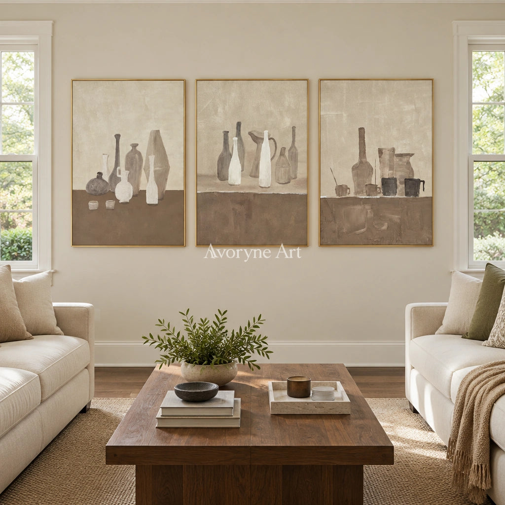 Muted Verse neutral pottery art triptych with a gold frame hanging in a living room