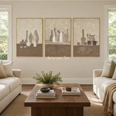 Muted Verse neutral pottery art triptych with a gold frame hanging in a living room