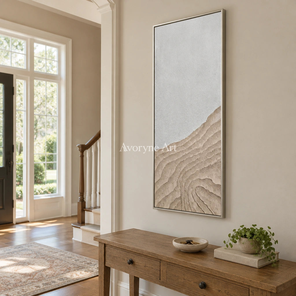 Muted Echo neutral ridge texture wall art with a silver frame in an entryway