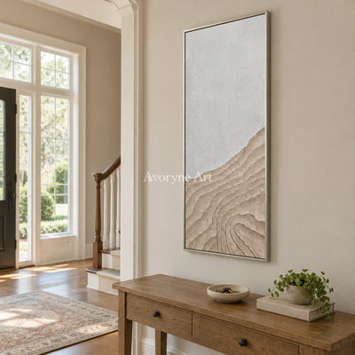 Muted Echo neutral ridge texture wall art with a silver frame in an entryway
