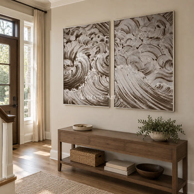 Muted Interval neutral wave relief diptych with a silver frame in an entryway