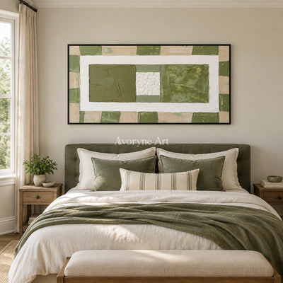 Soft Measure olive ivory grid wall art with a black frame above a bed in a bedroom