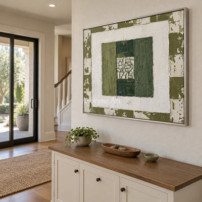 Hushed Haven olive ivory grid wall art with a silver frame in an entryway