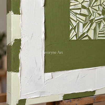 Close-up of the hand-painted texture of Hushed Trace olive ivory grid wall art on an easel