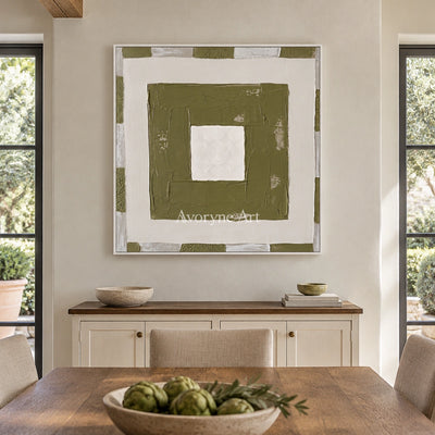 Hushed Drift olive ivory grid wall art with a white frame in a dining room