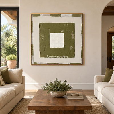 Hushed Drift olive ivory grid wall art with a gold frame hanging in a living room