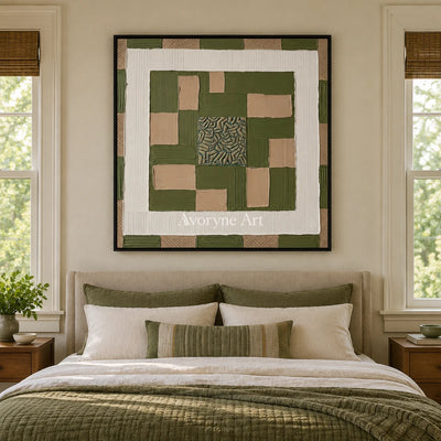 Hushed Horizon olive ivory grid wall art with a black frame above a bed in a bedroom