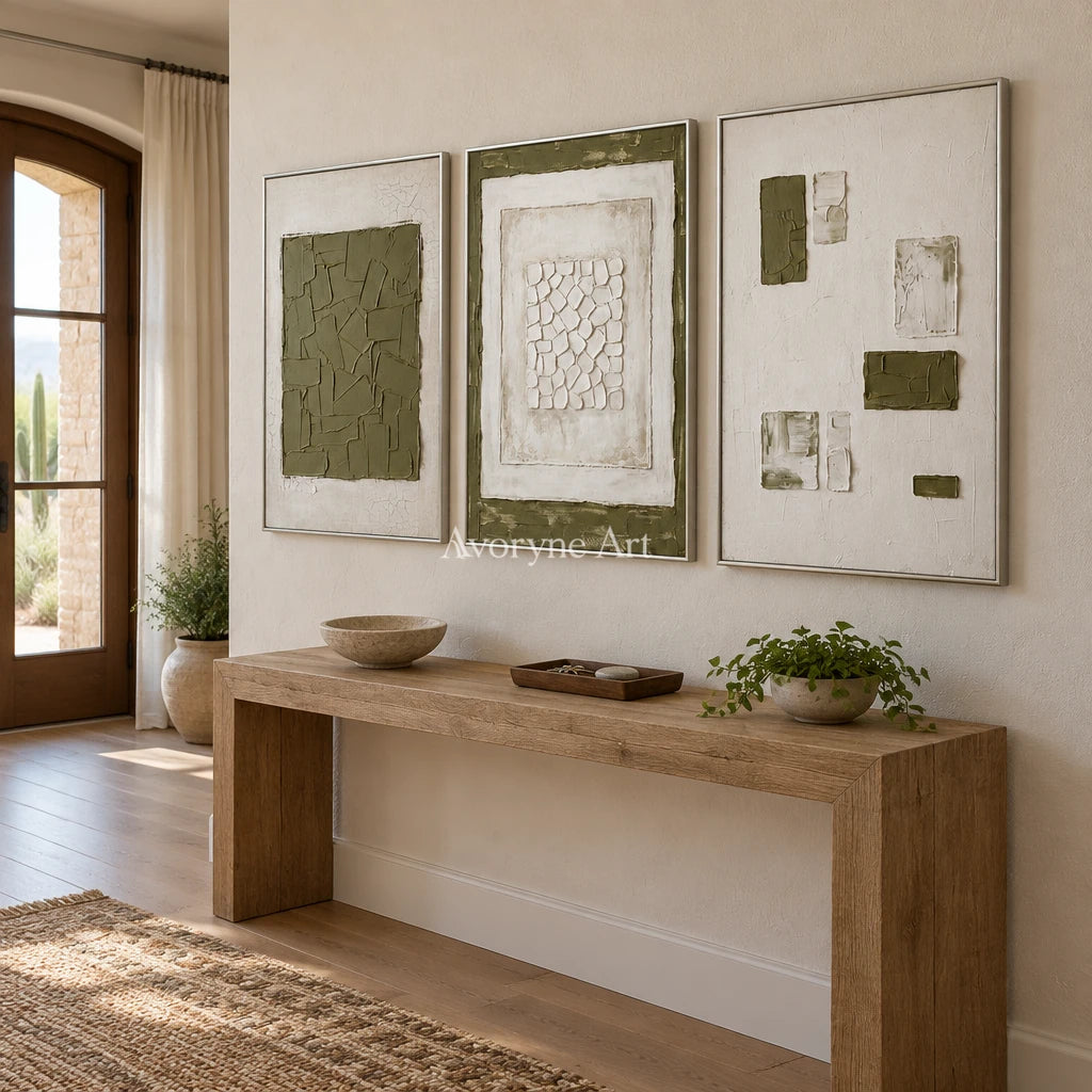 Earthen Field olive ivory grid triptych with a silver frame in an entryway