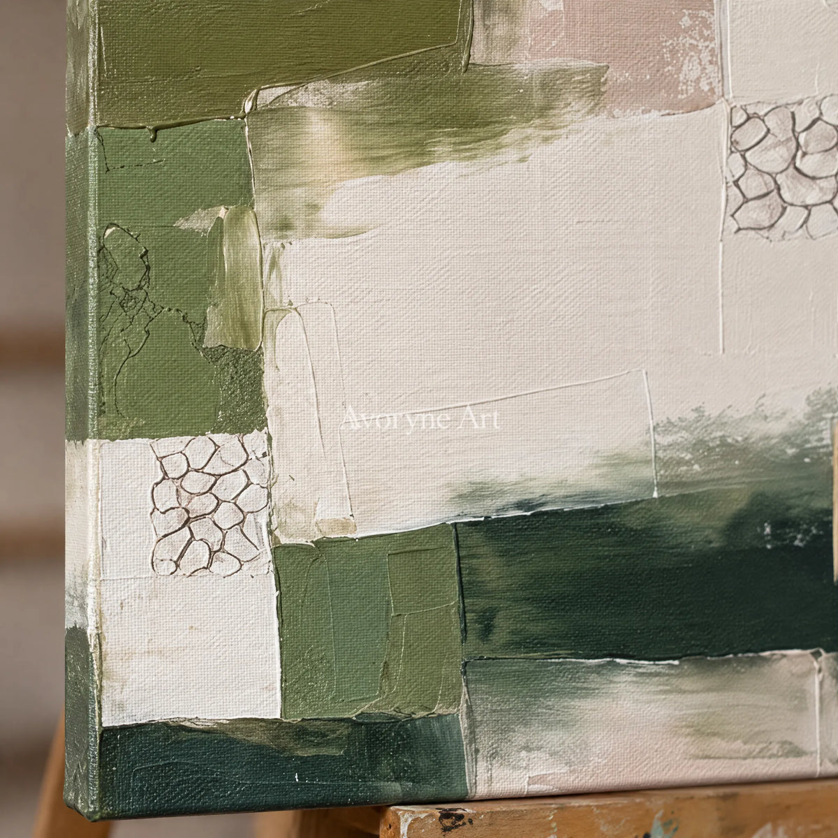 Close-up of the hand-painted texture of Hushed Cadence olive ivory grid triptych on an easel