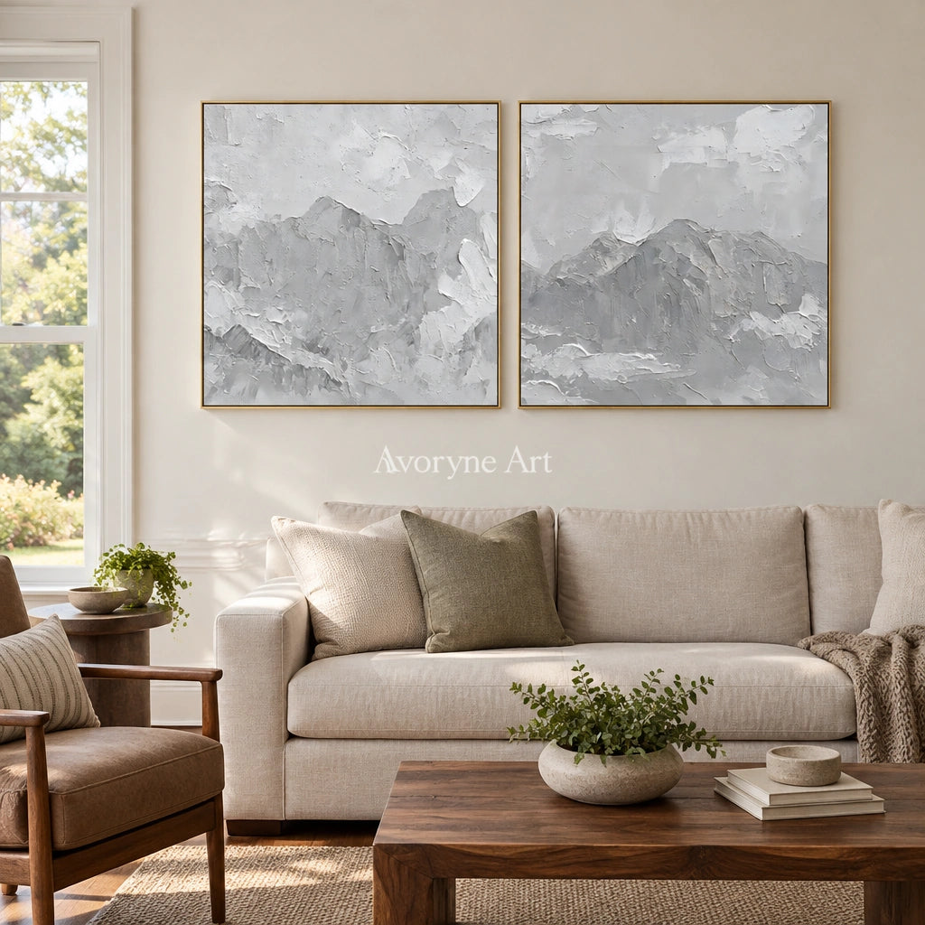 Muted Memory pale mountain relief diptych with a gold frame hanging in a living room