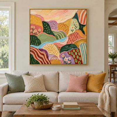 Amber Reverberation patterned field wall art with a gold frame hanging in a living room