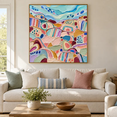 Soft Cadence patterned field wall art with a gold frame hanging in a living room