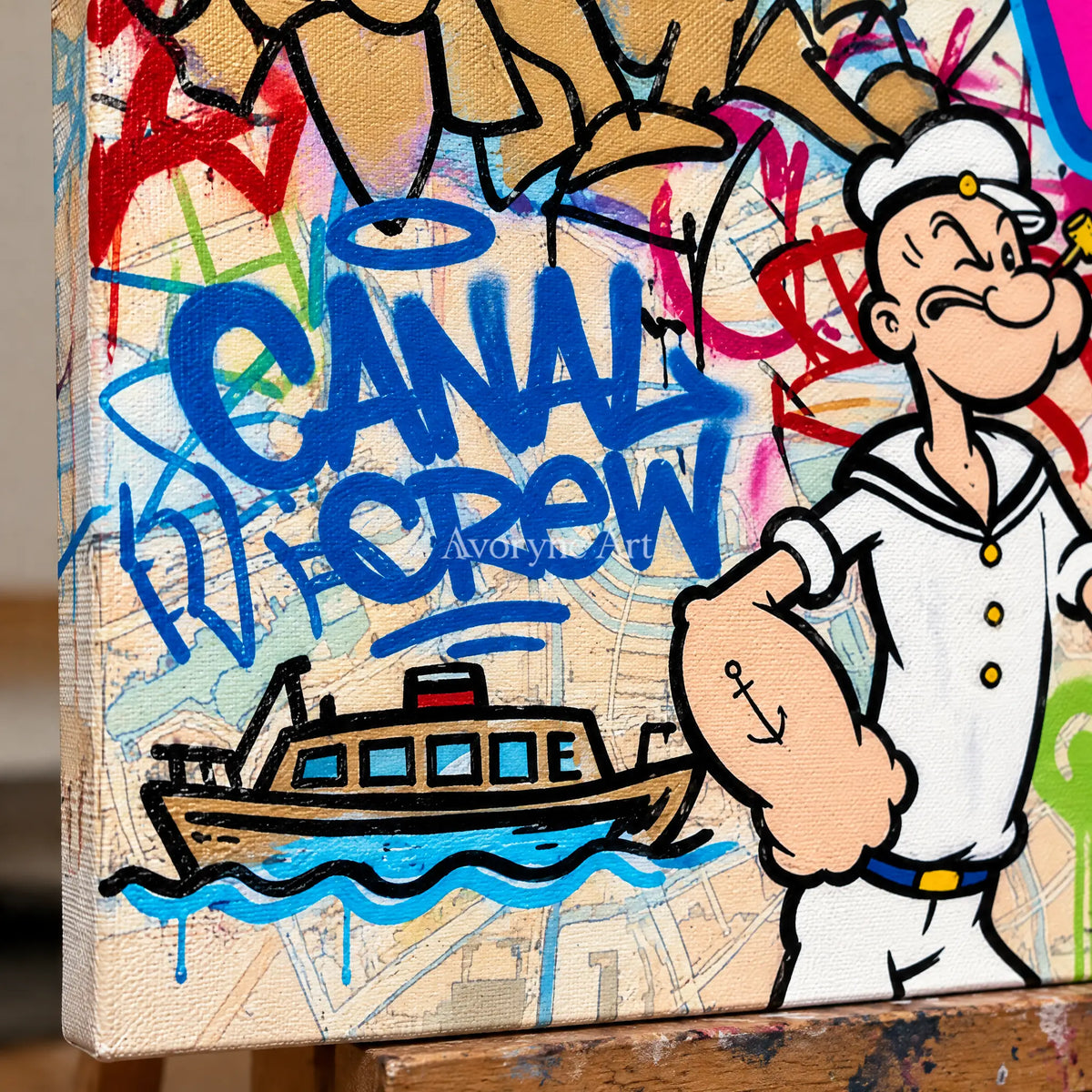 Close-up of the hand-painted texture of Soft Vista playful character wall art on an easel