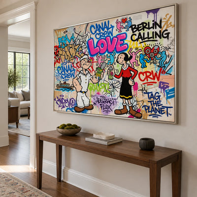 Soft Vista playful character wall art with a silver frame in an entryway