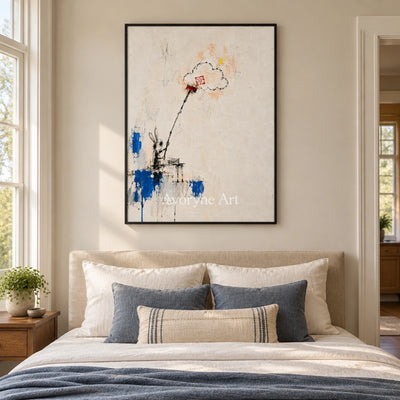 Open Drift playful character wall art with a black frame above a bed in a bedroom