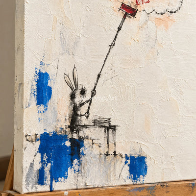 Close-up of the hand-painted texture of Open Drift playful character wall art on an easel