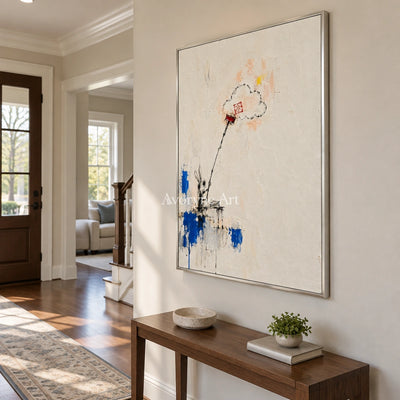 Open Drift playful character wall art with a silver frame in an entryway