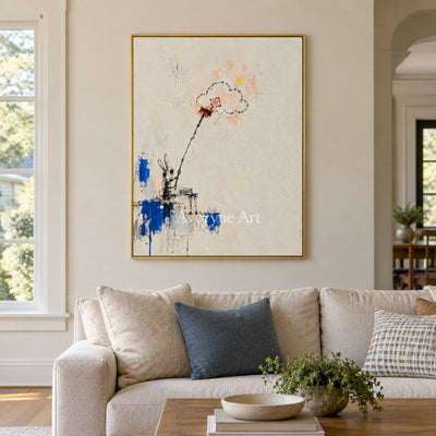 Open Drift playful character wall art with a gold frame hanging in a living room