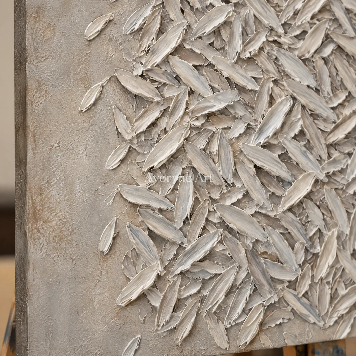 Close-up of the hand-painted texture of Amber Passage relief mosaic wall art on an easel