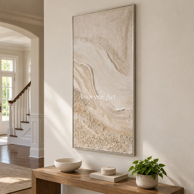 Quiet Story ripple relief wall art with a silver frame in an entryway