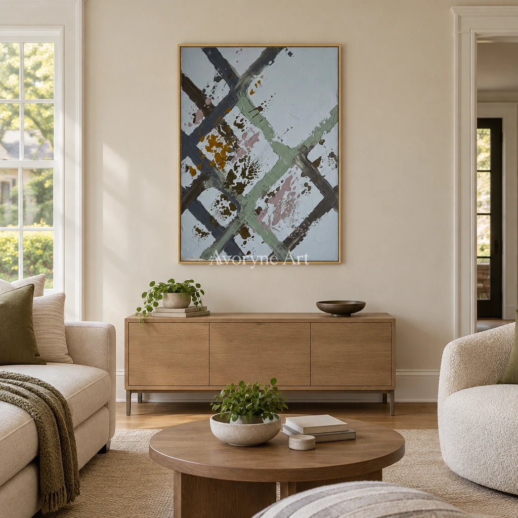 Weathered Cadence sage earth grid wall art with a gold frame hanging in a living room