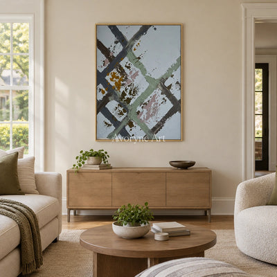 Weathered Cadence sage earth grid wall art with a gold frame hanging in a living room