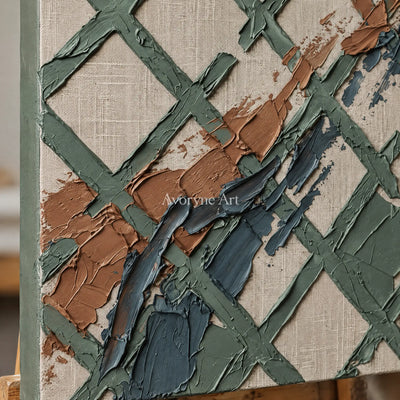 Close-up of the hand-painted texture of Weathered Solace sage earth grid wall art on an easel