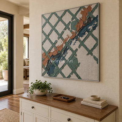 Weathered Solace sage earth grid wall art with a silver frame in an entryway