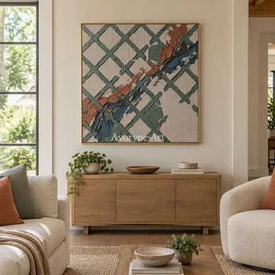 Weathered Solace sage earth grid wall art with a gold frame hanging in a living room