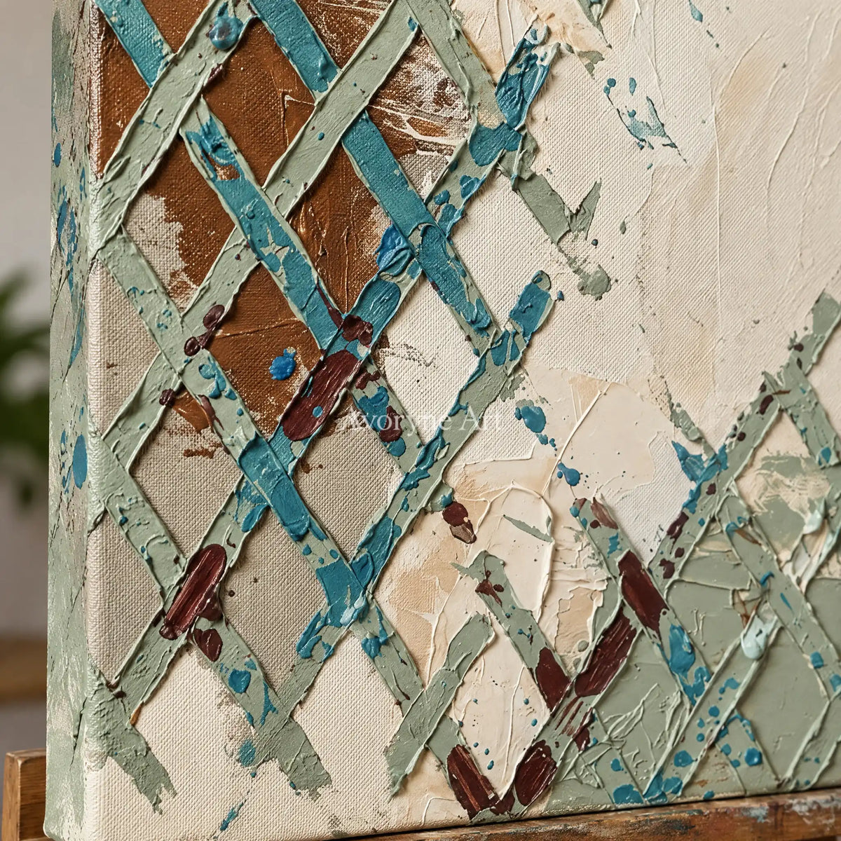 Close-up of the hand-painted texture of Weathered Sonata sage earth grid wall art on an easel