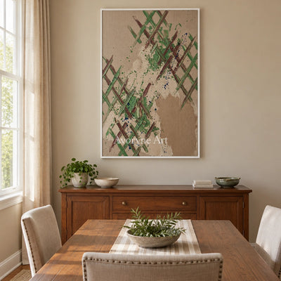 Earthen Trace sage earth grid wall art with a white frame in a dining room