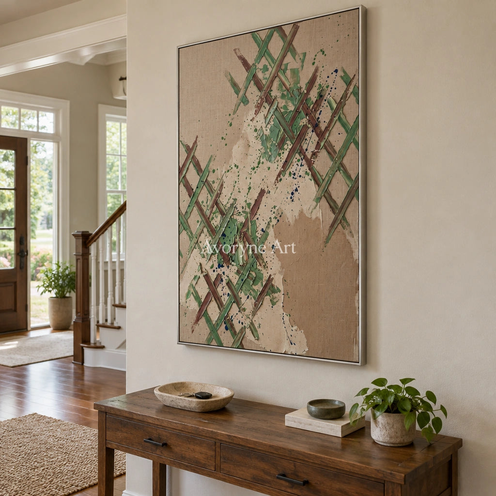 Earthen Trace sage earth grid wall art with a silver frame in an entryway