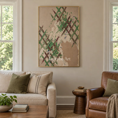 Earthen Trace sage earth grid wall art with a gold frame hanging in a living room