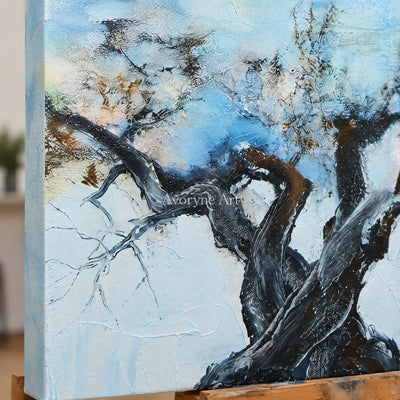 Close-up of the hand-painted texture of Blue Story snow branch wall art on an easel