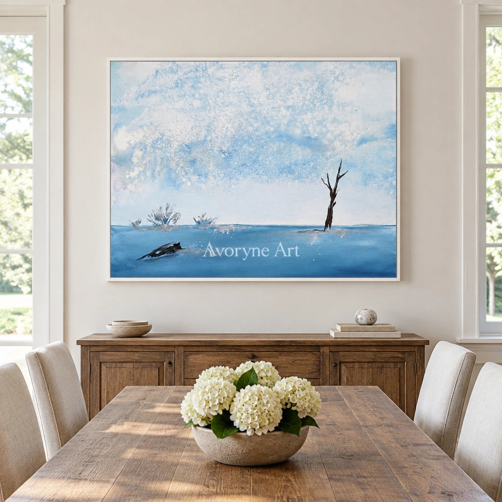 Blue Current snow branch wall art with a white frame in a dining room