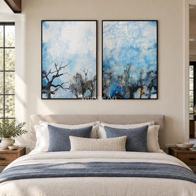 Pale Mosaic snow branch diptych with a black frame above a bed in a bedroom