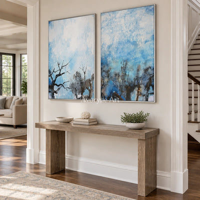 Pale Mosaic snow branch diptych with a silver frame in an entryway