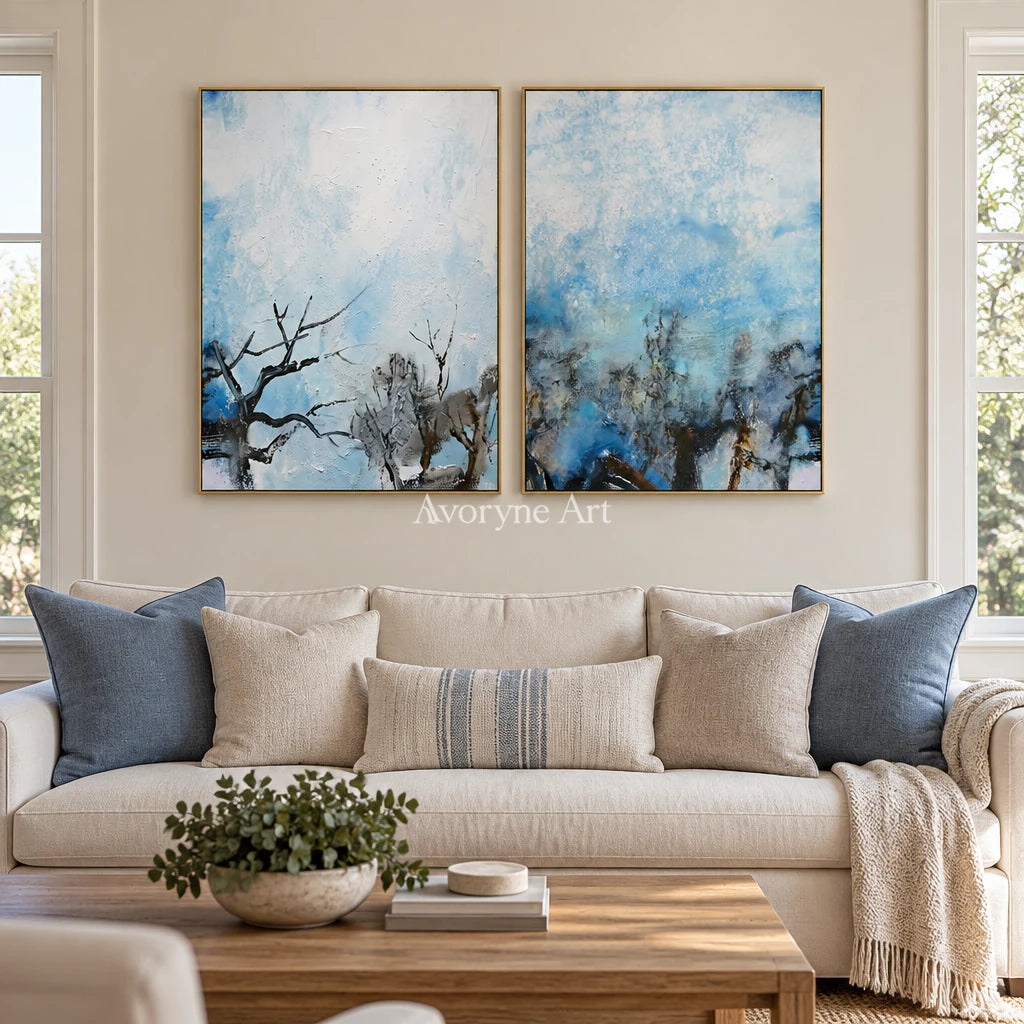 Pale Mosaic snow branch diptych with a gold frame hanging in a living room